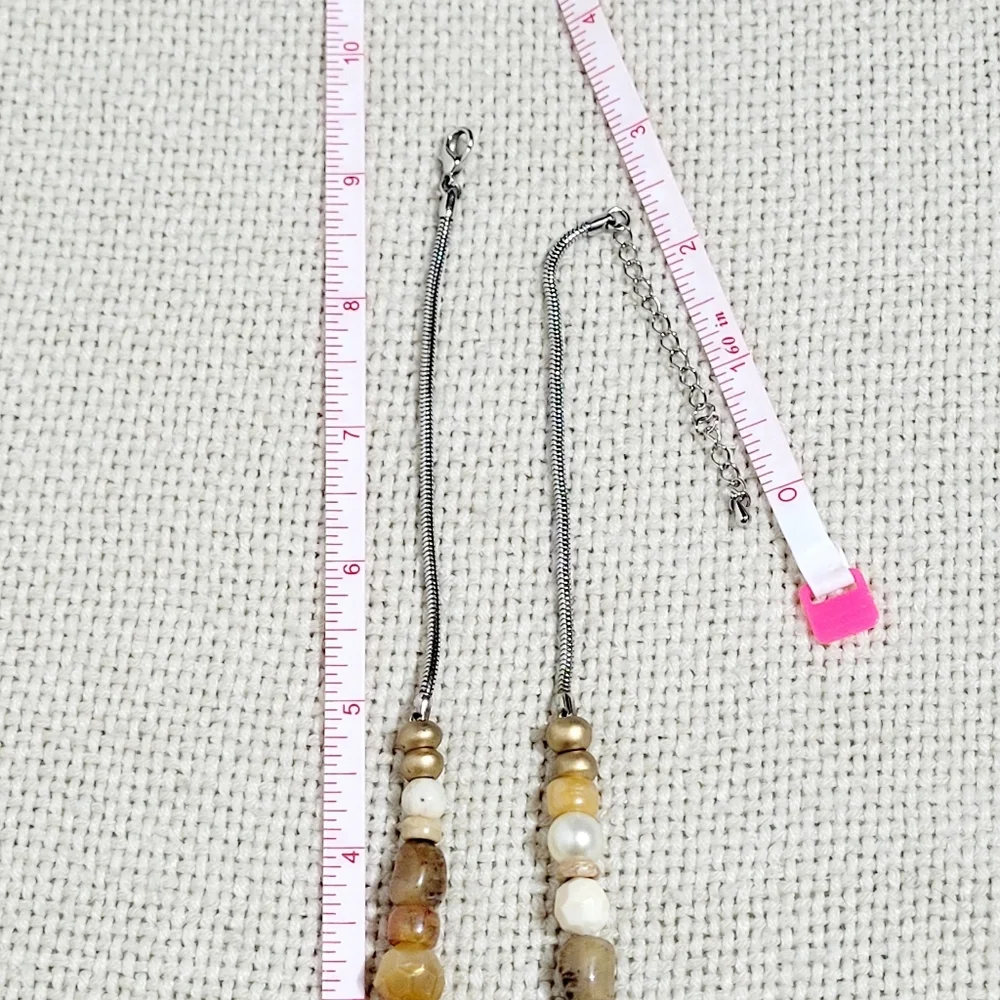 Silver and Gold Tone Necklace with a Bird, Butterfly and Beads.